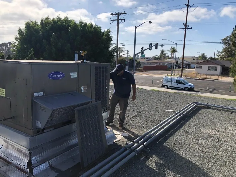 Cleaning a rooftop HVAC unit